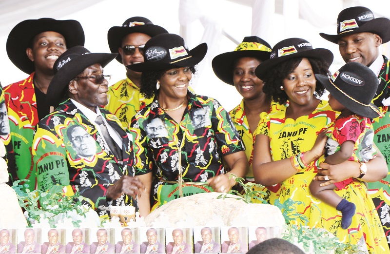 President Mugabe, First Lady Dr Grace Mugabe, with members of the First Family share a lighter moment as they prepare to cut the President’s birthday cake which was shaped like the Matobo Hills during celebrations to mark his 93rd birthday in Matobo, Matabeleland South Province yesterday