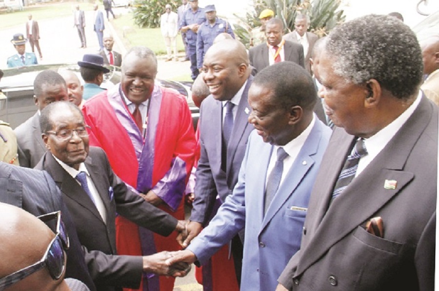 President Mugabe arrives for the Annual National Chiefs’ Conference at the Large City Hall in Bulawayo yesterday. Welcoming him are Vice-Presidents Emmerson Mnangagwa and Phelekezela Mphoko, president of the Chiefs Council Chief Fortune Charumbira and the Minister of Local Government, Public Works and National Housing Cde Saviour Kasukuwere