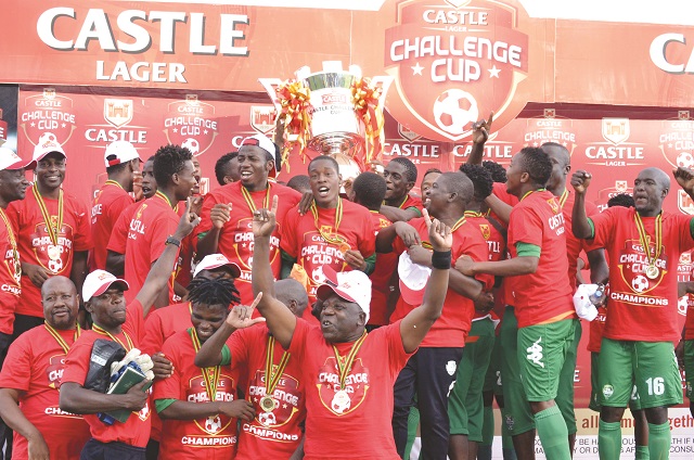 FC Platinum players and technical team members celebrate after winning the inaugural Castle Challenge Cup with a 2-1 victory over Harare City at Mandava Stadium in Zvishavane yesterday – Picture by Obey Sibanda