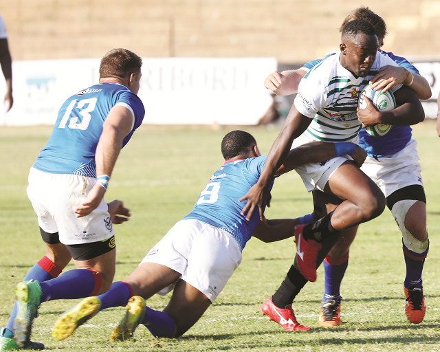 Zimbabwe Sables wing Shayne Makombe is tackled by Namibian players in a Rugby Africa Gold Cup match played at Hartsfield Rugby Ground yesterday