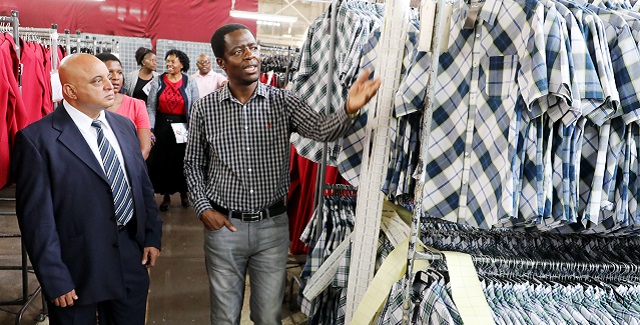 Edgars Stores Limited managing director — Corousel — Mr Menfree Tanyanyiwa takes Deputy Minister of Industry, Commerce and Enterprise Development Cde Raj Modi on a tour of the company in Belmont, Bulawayo